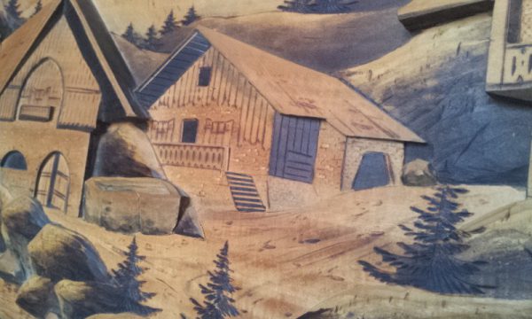 Dom tyrolski na drewnianym obrazie